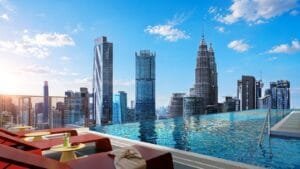 Rooftop infinity pool at Phoeniz Suites @ KLCC with Kuala Lumpur city skyline and KLCC view.